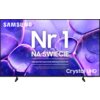 Telewizor z wyświetlonym na ekranie tekstem: "SAMSUNG Nr 1 NA ŚWIECIE Najczęściej kupowane telewizory od 19 lat Crystal UHD". Tło ekranu jest fioletowe z abstrakcyjnymi kształtami przypominającymi bąbelki.