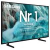 Telewizor z widocznym logo "SAMSUNG" na tle abstrakcyjnej grafiki w odcieniach niebieskiego, z dużym napisem "Nr 1 NA ŚWIECIE" oraz mniejszym tekstem "Najczęściej kupowane telewizory od 19 lat". W prawym dolnym rogu znajduje się napis "QLED".