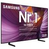 Telewizor z widocznym logo "SAMSUNG" oraz dużym napisem "Nr 1 NA ŚWIECIE" na tle abstrakcyjnej grafiki w odcieniach fioletu i pomarańczu. Dodatkowy tekst: "Najczęściej kupowane telewizory od 19 lat" oraz informacja o badaniu instytutu Omida.
