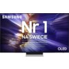 Na zdjęciu widoczny jest telewizor z wyświetlonym na ekranie tekstem: "SAMSUNG Nr 1 NA ŚWIECIE Najczęściej kupowane telewizory od 19 lat" oraz oznaczeniem "OLED". Tło ekranu jest abstrakcyjne, z dominującymi odcieniami fioletu i złota.