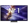 Telewizor z wyświetlonym na ekranie tekstem: "SAMSUNG Nr 1 NA ŚWIECIE Najczęściej kupowane telewizory od 19 lat" oraz "OLED". Tło ekranu przedstawia abstrakcyjne, kolorowe wzory.