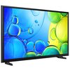 Na zdjęciu widoczny jest telewizor z kolorowym wyświetlaczem, na którym dominują niebieskie i zielone bąbelki. Na dolnej ramce telewizora znajduje się logo "SAMSUNG".