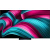 Telewizor OLED z wyświetlaczem prezentującym dynamiczny wzór w kolorach różowym i turkusowym. Na ekranie widoczny jest efekt falowania, tworzący wrażenie głębi i ruchu.