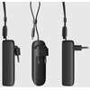 Czarny powerbank z wbudowaną wtyczką i przewodem, widoczny z trzech różnych perspektyw. Produkt ma gładką powierzchnię i kompaktowy kształt.