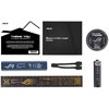 Na zdjęciu widoczne są różne elementy zestawu, w tym czarny przewodnik "Quick Start Guide" z logo ASUS oraz karta z napisem "THANK YOU for Purchasing an ASUS Graphics Card". Obok znajdują się dodatkowe akcesoria, takie jak okrągła naklejka z napisem "FOR 