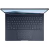 Laptop z widoczną klawiaturą i touchpadem, na którym znajduje się podświetlany panel numeryczny. Na ekranie widać fragment logo "ASUS Zenbook", a obok touchpada znajduje się napis "Dolby Vision".