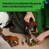 Na zdjęciu widoczne są zestawy klocków LEGO przedstawiające budowle z gry Minecraft, w tym wieża i mały domek. Na zielonym tle znajduje się tekst: "Interaktywna zabawka dla gracza, która rozwija kreatywność".