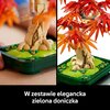 Zdjęcie przedstawia model LEGO bonsai z czerwono-pomarańczowymi liśćmi i zieloną doniczką. Na dole zdjęcia znajduje się tekst: "W zestawie elegancka zielona doniczka".
