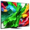 Telewizor z cienką ramką wyświetla kolorową grafikę z dynamicznymi, abstrakcyjnymi kształtami w odcieniach zieleni, niebieskiego, czerwieni i żółci. Na ekranie nie ma widocznego tekstu ani logo.