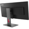 Czarny monitor z zakrzywionym ekranem, widoczny od tyłu, z logo "Lenovo" w lewym górnym rogu. Monitor jest zamontowany na prostokątnej podstawie z pionowym wspornikiem, który ma czerwony akcent.