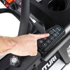 Na zdjęciu widoczny jest panel sterowania bieżni elektrycznej z przyciskami oznaczonymi cyframi oraz przyciskami do regulacji prędkości z napisami "SPEED / SLED" i "START". Obok panelu znajduje się pokrętło z napisem "RELEASE" oraz logo "TUNTURI".