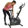 Na zdjęciu znajduje się rower magnetyczny z napisem "Star Fit B100" oraz logo "TUNTURI" na obudowie. Na uchwycie roweru umieszczona jest zielona butelka na wodę.