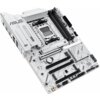 Biała płyta główna z widocznymi gniazdami i złączami, na której znajduje się napis "X870 MAX GAMING WiFi7" oraz logo "ASUS". Płyta posiada różne porty i komponenty, w tym gniazda RAM i PCIe.