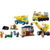 Zestaw LEGO 60391 City zawiera żółto-niebieską ciężarówkę, żółty dźwig z kulą wyburzeniową, mały budynek z numerem "3" oraz figurki pracowników budowy z akcesoriami. Widoczne są również elementy takie jak taczka, pachołki, pająk i niebieski plan budowy z 