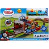Opakowanie przedstawia zestaw kolejki z serii "Thomas & Friends" z napisem "Load & Launch Barrel Delivery Set". Na opakowaniu widnieje informacja o długości toru wynoszącej 18 stóp/5 metrów oraz hasło "Barrel Launching Fun!".
