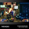 Na zdjęciu widoczna jest scena z gry wideo, przedstawiająca dwóch walczących bohaterów na tle miejskiej ulicy z neonowymi znakami. Na dole znajduje się napis "NEOGEO" oraz "THE KING OF FIGHTERS 2000 2000 / FIGHTING / NEOGEO".
