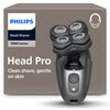 Opakowanie golarki z widocznym napisem "PHILIPS Head Shaver 7000 Series Head Pro Clean shave, gentle on skin" oraz ilustracją golarki z czterema okrągłymi głowicami. Na opakowaniu znajduje się również ikona przedstawiająca zarys głowy z brodą.
