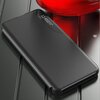 Czarne etui na telefon z widocznym wyświetlaczem pokazującym godzinę 12:45 oraz datę. Tło jest metaliczne z czerwonym elementem w górnej części zdjęcia.