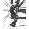 Zbliżenie na mechanizm tylnej przerzutki roweru z widocznymi zębatkami i łańcuchem. Na przerzutce widoczne są napisy: "Shimano" i "Tourney".