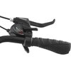 Czarno-zielony uchwyt rowerowy z widoczną manetką przerzutek marki Shimano, oznaczoną cyframi 7, 6, 5, 4, 3, 2, 1 oraz napisem "HIGH". Obok znajduje się dźwignia hamulca z napisem "V-BRAKE".