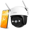 Na obrazie znajduje się kamera zewnętrzna z dwoma antenami, a obok niej smartfon z wyświetlonym logo "IMOU" na pomarańczowym tle. Kamera ma biało-czarną obudowę i widoczne diody LED wokół obiektywu.