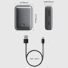 Na zdjęciu widoczny jest szary powerbank z oznaczeniami "10000 mAh" i "AUKEY", obok którego znajduje się kabel USB o długości 30 cm. Powerbank ma wymiary 2.2"/56mm szerokości, 0.98"/25mm grubości i 3.11"/79mm wysokości.