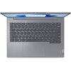 Szary laptop z widoczną klawiaturą i touchpadem, na ekranie wyświetlany jest interfejs systemu operacyjnego. Na obudowie znajduje się logo "Lenovo".
