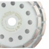 Na zdjęciu widoczna jest tarcza do szlifowania z oznaczeniami: "57T325 GRAPHITE CONCRETE EN13236", "Ø180 mm", "max 80 m/s", "max 8600 obr/min". Tarcza ma otwory i segmenty szlifierskie rozmieszczone na obwodzie.