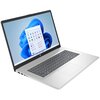 Laptop z dużym ekranem wyświetla pulpit systemu Windows 11 z ikonami aplikacji. Obudowa jest srebrna, a klawiatura ma ciemne klawisze.