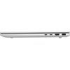 Srebrny laptop z zamkniętą pokrywą, widoczny z boku, prezentuje różne porty: dwa porty USB-C, port HDMI oraz port USB-A. Obudowa jest smukła i nowoczesna, co podkreśla elegancki design urządzenia.