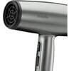 Zdjęcie przedstawia suszarkę do włosów w metalicznym kolorze z widocznym logo "BaByliss" na obudowie. Na uchwycie znajdują się dwa przyciski oraz symbol płatka śniegu.