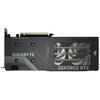 Czarna karta graficzna z widocznymi napisami: "GIGABYTE", "GEFORCE RTX", "POWER DESIGN", "LOADING" oraz "GAMING". Na powierzchni karty znajdują się wzory przypominające linie i kropki, a przez otwory widać elementy chłodzenia.