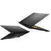 Dwa laptopy w kolorze czarnym, częściowo otwarte, z widocznym logo "TUF" na pokrywie. Laptopy mają nowoczesny design z wyraźnymi otworami wentylacyjnymi i portami po bokach.