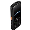 Telefon komórkowy o solidnej, czarnej obudowie z widocznym logo "HAMMER" na dole ekranu. Na bocznej krawędzi znajduje się pomarańczowy przycisk, a klawiatura numeryczna jest wyraźnie widoczna z białymi oznaczeniami liter i cyfr.