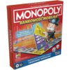 Czerwone pudełko gry planszowej z napisem "MONOPOLY BANKOWOŚĆ MOBILNA" oraz ilustracją postaci trzymającej kartę i urządzenie mobilne. Na pudełku widnieje tekst: "Graj na planszy, zarządzaj pieniędzmi na osobnym urządzeniu. Skanuj kartę, by kupować, uleps