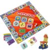Plansza do gry Monopoly Bankowość Mobilna z kolorowymi polami, kartami, banknotami i dwoma kostkami do gry. Na środku planszy widnieje napis "MONOPOLY BANKOWOŚĆ MOBILNA", a w rogu logo "Hasbro Gaming".