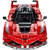 Czerwony model samochodu z klocków, z widocznymi detalami technicznymi, takimi jak silnik i kierownica. Na przodzie znajduje się logo z czarnym koniem na żółtym tle oraz napis "FXX K" na boku.