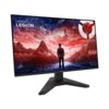 Monitor z cienkimi ramkami wyświetla grafikę przedstawiającą osobę stojącą przed krajobrazem górskim w czerwono-niebieskiej tonacji, z logo "Lenovo LEGION" w lewym górnym rogu. Na podstawie monitora widnieje napis "LEGION".