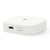 Biały, prostokątny inteligentny sterownik z zaokrąglonymi krawędziami, posiada port USB-C i przycisk na jednym z boków. Na górnej powierzchni widoczne jest małe logo w kształcie sześciokąta.