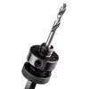 Na zdjęciu znajduje się metalowy adapter do otwornic z wiertłem, wykonany z ciemnego metalu z widocznymi gwintami i otworami montażowymi. Produkt ma teksturowaną powierzchnię na dolnej części, co ułatwia jego uchwyt.