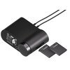 Czarny moduł z pokrętłem i wyświetlaczem, na którym widoczne są ikony i napisy: "USB", "VOL", "48 kHz", "7.1", "2.4 GHz". Obok leżą dwie płaskie baterie z logo "steelseries".