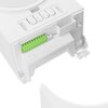 Zbliżenie na biały element urządzenia z widocznym zielonym złączem elektrycznym oraz czterema przyciskami oznaczonymi symbolami. Na powierzchni obok złącza znajdują się drobne oznaczenia techniczne.