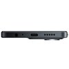 Czarny smartfon widziany z boku, ukazujący porty: gniazdo słuchawkowe, mikrofon, port USB-C oraz otwory głośnika. Na zdjęciu widoczny jest również wystający moduł aparatu.