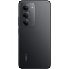Czarny smartfon z trzema obiektywami aparatu i lampą błyskową umieszczonymi w prostokątnej ramce. Na obudowie widoczny jest napis "REDMI" oraz "INNOVATIVE AI CAMERA".