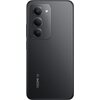 Czarny smartfon z trzema obiektywami aparatu i lampą błyskową umieszczonymi w pionowym module. Na obudowie widoczny jest napis "REDMI 5G".