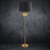 Czarno-złota lampa podłogowa o wysokości 165 cm z okrągłą podstawą i prostym trzonem, zakończona dużym, ciemnym abażurem. Na trzonie znajduje się ozdobna, złota kula.