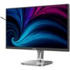 Monitor z cienkimi ramkami wyświetla abstrakcyjny, kolorowy wzór w odcieniach niebieskiego i fioletowego. Na dolnej ramce widoczne jest logo "PHILIPS", a monitor stoi na metalowej podstawie.