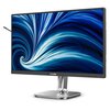 Monitor z logo "PHILIPS" na dolnej ramce, wyświetlający dynamiczny, niebiesko-biały wzór przypominający wir. Monitor jest zamontowany na srebrnej podstawie z okrągłą stopą.
