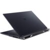 Na zdjęciu widoczny jest laptop z ciemną obudową, częściowo otwarty, z widocznym logo producenta na pokrywie. Laptop posiada różne porty z tyłu, a jego konstrukcja jest nowoczesna i kanciasta.