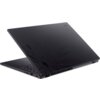 Czarny laptop z widocznym wzorem na obudowie, częściowo otwarty, ukazujący klawiaturę i porty boczne. Na obudowie znajduje się napis "NITRO".